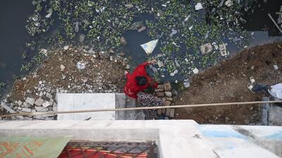 Water overflowing from a sewer in Delhi. (HT File) Water overflowing from a sewer in Delhi. (HT File)