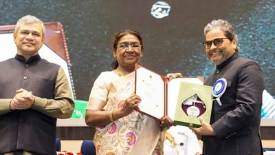 President Droupadi Murmu with music composer and filmmaker Vishal Bhardwaj on the stage after presenting him the National Film Award. (PTI) President Droupadi Murmu with music composer and filmmaker Vishal Bhardwaj on the stage after presenting him the National Film Award. (PTI)