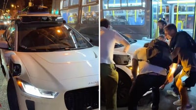 A video showing the CEOs trying to move the Waymo car away from the bus has gone viral on social media. (X/@freddier) A video showing the CEOs trying to move the Waymo car away from the bus has gone viral on social media. (X/@freddier)