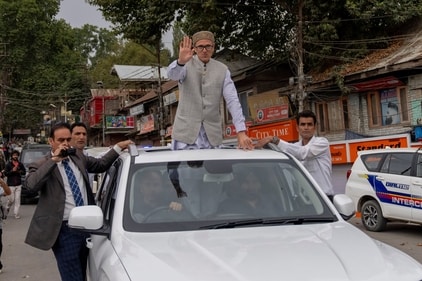 Jammu and Kashmir National Conference (JKNC) party leader Omar Abdullah, standing on car waves to supporters as he celebrates his victory in the assembly election. (AP) Jammu and Kashmir National Conference (JKNC) party leader Omar Abdullah, standing on car waves to supporters as he celebrates his victory in the assembly election. (AP)