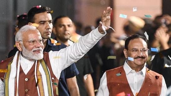 Prime Minister Narendra Modi greets Bharatiya Janata Party (BJP) workers and leaders after the party's victory in the Haryana Assembly elections, at the party headquarter in New Delhi on Tuesday. (ANI)