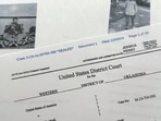 The criminal complaint, filed by the Justice Department, against Nasir Ahmad Tawhedi, 27,of Oklahoma City is photographed Tuesday, Oct. 8, after the FBI arrested the man who officials say was inspired by the Islamic State militant organization and was plotting an Election Day attack targeting large crowds in the U.S. (AP Photo/Jon Elswick) The criminal complaint, filed by the Justice Department, against Nasir Ahmad Tawhedi, 27,of Oklahoma City is photographed Tuesday, Oct. 8, after the FBI arrested the man who officials say was inspired by the Islamic State militant organization and was plotting an Election Day attack targeting large crowds in the U.S. (AP Photo/Jon Elswick)