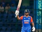 India's Nitish Kumar Reddy celebrates his half century during the second T20 International cricket match against Bangladesh. India's Nitish Kumar Reddy celebrates his half century during the second T20 International cricket match against Bangladesh.