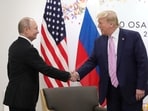 FILE PHOTO: Russia's President Vladimir Putin shakes hands with U.S. President Donald Trump during a meeting on the sidelines of the G20 summit in Osaka, Japan June 28, 2019. Sputnik/Mikhail Klimentyev/Kremlin via REUTERS  ATTENTION EDITORS - THIS IMAGE WAS PROVIDED BY A THIRD PARTY./File Photo