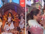 The image shows the Indian-origin woman in the US visiting the Durga Puja pandal at Times Square. The image shows the Indian-origin woman in the US visiting the Durga Puja pandal at Times Square.
