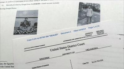 The criminal complaint, filed by the Justice Department, against Nasir Ahmad Tawhedi, 27,of Oklahoma City is photographed Tuesday, Oct. 8, after the FBI arrested the man who officials say was inspired by the Islamic State militant organization and was plotting an Election Day attack targeting large crowds in the U.S. (AP Photo/Jon Elswick) (AP) The criminal complaint, filed by the Justice Department, against Nasir Ahmad Tawhedi, 27,of Oklahoma City is photographed Tuesday, Oct. 8, after the FBI arrested the man who officials say was inspired by the Islamic State militant organization and was plotting an Election Day attack targeting large crowds in the U.S. (AP Photo/Jon Elswick) (AP)