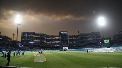 Ground staff cover the field after rain delayed a match at Arun Jaitley Stadium in Delhi Ground staff cover the field after rain delayed a match at Arun Jaitley Stadium in Delhi