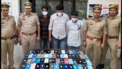 The three men in police custody, along with the recovered phones on Wednesday. (HT Photo) The three men in police custody, along with the recovered phones on Wednesday. (HT Photo)
