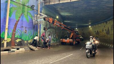 Workers install drainage pumps at an underpass near Tau Devilal Stadium in August, before MCC kicked in for Haryana polls. (HT Photo) Workers install drainage pumps at an underpass near Tau Devilal Stadium in August, before MCC kicked in for Haryana polls. (HT Photo)
