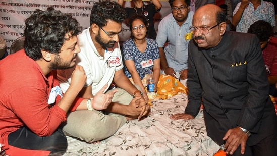 West Bengal Governor C V Ananda Bose interacts with junior doctors sitting on a hunger strike in protest against the rape and murder of a woman medic at the RG Kar Medical College and Hospital, in Kolkata. (PTI)