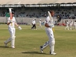 England's Harry Brook walks off for lunch with Joe Root