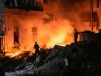 Flames and smoke rise at the scene of destroyed buildings hit by an Israeli airstrike in central Beirut, Lebanon, Thursday, Oct. 10, 2024. (AP Photo/Bilal Hussein)