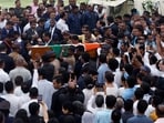 Policemen carry a coffin of the former chairman of Tata Group Ratan Tata before the funeral, in Mumbai.