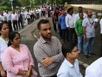Despite the humid, salty air and rising temperatures, people stood in line for at least 30 minutes each