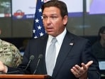 Florida Governor Ron DeSantis speaks about Hurricane Helene as Adjutant General of Florida Major General John Haas looks on during a press briefing at the Emergency Operations Center in Tallahassee, Florida, U.S., September 26, 2024.   REUTERS/Phil Sears/File Photo