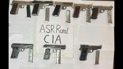 Eight pistols, 17 live cartridges and four magazines have been recovered . (HT Photo)
