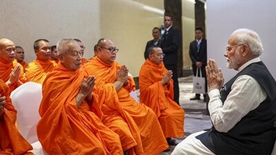 Narendra Modi participates in a blessing ceremony in Vientiane, Laos, on Thursday. (PTI) Narendra Modi participates in a blessing ceremony in Vientiane, Laos, on Thursday. (PTI)
