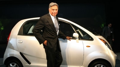 Tata Group's Ratan Tata poses in front of the Tata Nano in New Delhi on January 10, 2008. (AFP) Tata Group's Ratan Tata poses in front of the Tata Nano in New Delhi on January 10, 2008. (AFP)
