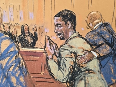 Sean 'Diddy' Combs' bows and waves back to friends and family who wave at him as he attends a hearing in federal court .REUTERS/Jane Rosenberg (REUTERS)