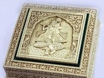 Prime Minister Narendra Modi gifted a Malachite and Camel Bone Box with Radha-Krishna theme to Vandara Siphandone, the wife of PM of Lao PDR, Sonexay Siphandone, in Vientiane on Friday. Crafted from high-quality malachite and intricately carved camel bone, the box combines durability with a luxurious feel. The detailed depiction of Radha and Krishna, capturing their playful interactions, and the traditional motifs and designs add to its cultural significance. The exquisite malachite and camel bone box with the Radha Krishna theme is more than just an ornamental object; it is a celebration of art, culture, and spirituality. Its unique design and high-quality craftsmanship make it a timeless piece that will be treasured for generations.