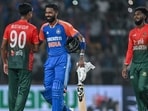 India's Hardik Pandya (C) shakes hands with Bangladesh's Mustafizur Rahman at the end of the first T20I match in Gwalior.