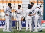 Pakistan players celebrates with teammates after taking a catch to dismiss England's Gus Atkinson