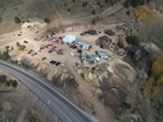 Emergency personnel stage outside the Mollie Kathleen Gold Mine in Cripple Creek, Colo., Thursday, Oct. 10, 2024, after one person died in an equipment malfunction during a tour of the mine according to the Teller County Sheriff's Department. Twelve other people remained trapped 500 feet below as of 4:30 p.m. (Arthur Trickette-Wile/The Gazette via AP)