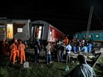 People watch as members of the National Disaster Response Force (NDRF) inspect the site after after several coaches of the Mysuru-Darbhanga Bagmati Express (12578) train derailed after ramming into the rear of a goods train at the Kavaraipettai Railway Station on October 12. People watch as members of the National Disaster Response Force (NDRF) inspect the site after after several coaches of the Mysuru-Darbhanga Bagmati Express (12578) train derailed after ramming into the rear of a goods train at the Kavaraipettai Railway Station on October 12.