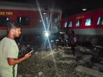 Tamil Nadu: Passengers near the derailed coaches after an express train rammed into a stationary train, at Kavarapettai in Tiruvallur district on October 11. Tamil Nadu: Passengers near the derailed coaches after an express train rammed into a stationary train, at Kavarapettai in Tiruvallur district on October 11.