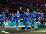 Greece's Vangelis Pavlidis celebrates scoring their second goal with teammate.