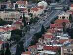 A street in Haifa in northern Israel is nearly deserted as Yom Kippur begins at sunset on October 11, 2024. (Photo by Ahmad GHARABLI / AFP)