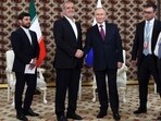 In this pool photograph distributed by the Russian state agency Sputnik, Russia's President Vladimir Putin meets with Iran's President Masoud Pezeshkian on the sidelines of an international forum "Interrelation of times and civilizations - basis of peace and development" dedicated to the 300th anniversary of poet Magtymguly Fragi's birthday in Ashgabat on October 11, 2024. (Photo by Alexander SHCHERBAK / POOL / AFP)