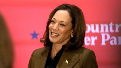 Democratic presidential nominee Vice President Kamala Harris speaks as an attendee looks on at a campaign event Friday, Oct. 11, 2024, at the Grayhawk Golf Club in Scottsdale, Ariz. (AP Photo/Ross D. Franklin) (AP) Democratic presidential nominee Vice President Kamala Harris speaks as an attendee looks on at a campaign event Friday, Oct. 11, 2024, at the Grayhawk Golf Club in Scottsdale, Ariz. (AP Photo/Ross D. Franklin) (AP)