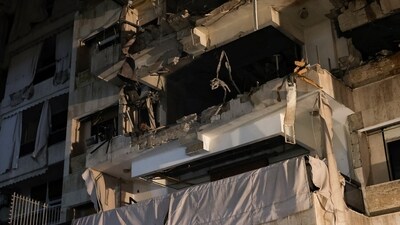 A damaged building stands at the site of an Israeli air strike, amid ongoing hostilities between Hezbollah and Israeli forces, in Beirut, Lebanon, (REUTERS)