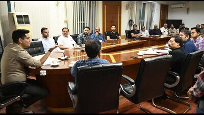 MC commissioner Aaditya Dachalwal interacting with industrialists at Zone D office on Friday. (HT photo) MC commissioner Aaditya Dachalwal interacting with industrialists at Zone D office on Friday. (HT photo)