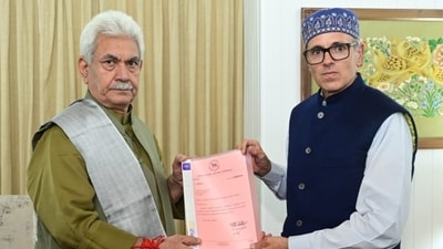 National Conference vice president Omar Abdullah meets lieutenant governor Manoj Sinha at Raj Bhawan on Friday to stake a claim for forming the government in Jammu and Kashmir. (J&K Raj Bhavan) National Conference vice president Omar Abdullah meets lieutenant governor Manoj Sinha at Raj Bhawan on Friday to stake a claim for forming the government in Jammu and Kashmir. (J&K Raj Bhavan)