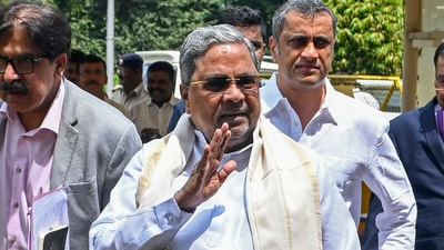 Karnataka Chief Minister Siddaramaiah with his legal advisor Ponnanna. (PTI) Karnataka Chief Minister Siddaramaiah with his legal advisor Ponnanna. (PTI)
