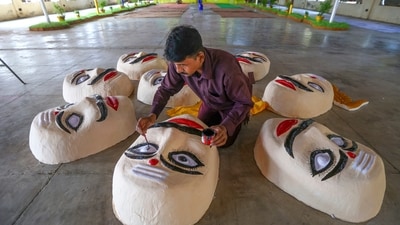 An artist prepares effigies of the demon king Ravana for the Dussehra festival celebration. (PTI) An artist prepares effigies of the demon king Ravana for the Dussehra festival celebration. (PTI)