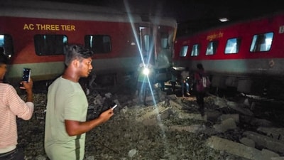 Tamil Nadu: Passengers near the derailed coaches after an express train rammed into a stationary train, at Kavarapettai in Tiruvallur district on October 11. (PTI) Tamil Nadu: Passengers near the derailed coaches after an express train rammed into a stationary train, at Kavarapettai in Tiruvallur district on October 11. (PTI)