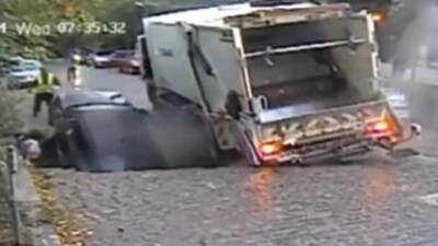 A mother and her five-year-old son fell into a road crater in Bucharest, Romania, during drop-off at kindergarten, but both were safely rescued. (X/@Ian_Collins_03) A mother and her five-year-old son fell into a road crater in Bucharest, Romania, during drop-off at kindergarten, but both were safely rescued. (X/@Ian_Collins_03)
