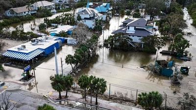 TOPSHOT - A drone image shows a flooded street due to Hurricane Milton in Siesta Key, Florida, on October 10, 2024. At least four people were confirmed killed as a result of two tornadoes triggered by Hurricane Milton on the east coast of the US state of Florida, local authorities said Thursday. (Photo by Miguel J. Rodriguez Carrillo / AFP) (AFP) TOPSHOT - A drone image shows a flooded street due to Hurricane Milton in Siesta Key, Florida, on October 10, 2024. At least four people were confirmed killed as a result of two tornadoes triggered by Hurricane Milton on the east coast of the US state of Florida, local authorities said Thursday. (Photo by Miguel J. Rodriguez Carrillo / AFP) (AFP)