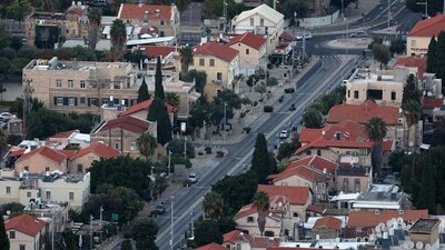 A street in Haifa in northern Israel is nearly deserted as Yom Kippur begins at sunset on October 11, 2024. (Photo by Ahmad GHARABLI / AFP) (AFP)