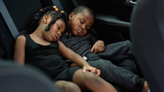 Siblings Saboria, 4, left, and Messiah Tyler, 3, nap in the backseat of a car after the roof was torn off the home where they lived with their mom, grandparents, an aunt and an uncle during the passage of Hurricane Milton, in Palmetto, Fla., Thursday, Oct. 10, 2024.(AP)