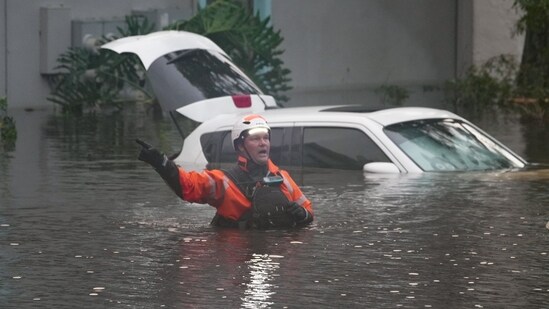 &nbsp;First responders in the water outside an apartment complex that was flooded from and overflowing creek due to Hurricane Milton on October 10, 2024 in Clearwater, Florida. &nbsp;(Photo by Bryan R. SMITH / AFP)(AFP)