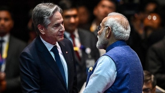 US Secretary of State Antony Blinken shakes hands with Prime Minister Narendra Modi at the 19th East Asia Summit in Vientiane on Friday. (AFP)