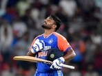 India's Sanju Samson celebrates after scoring a century (100 runs) during the third and final Twenty20 international cricket match between India and Bangladesh