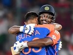 India's Sanju Samson celebrates with captain Suryakumar Yadav after scoring a century (100 runs) during the third and final Twenty20 international cricket match.