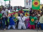Demonstrators hold banners reading in Swahili  "Sitaki nuclear" during an anti-nuclear protest in Kilifi, Kenya.