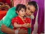 Bipasha Basu with little Devi at a Durga puja pandal in Mumbai. Bipasha Basu with little Devi at a Durga puja pandal in Mumbai.