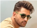 Mahendra Singh Dhoni looked dapper in a stylish look featuring a voluminous top with back brushed look, with trimmed sides. Mahendra Singh Dhoni looked dapper in a stylish look featuring a voluminous top with back brushed look, with trimmed sides.